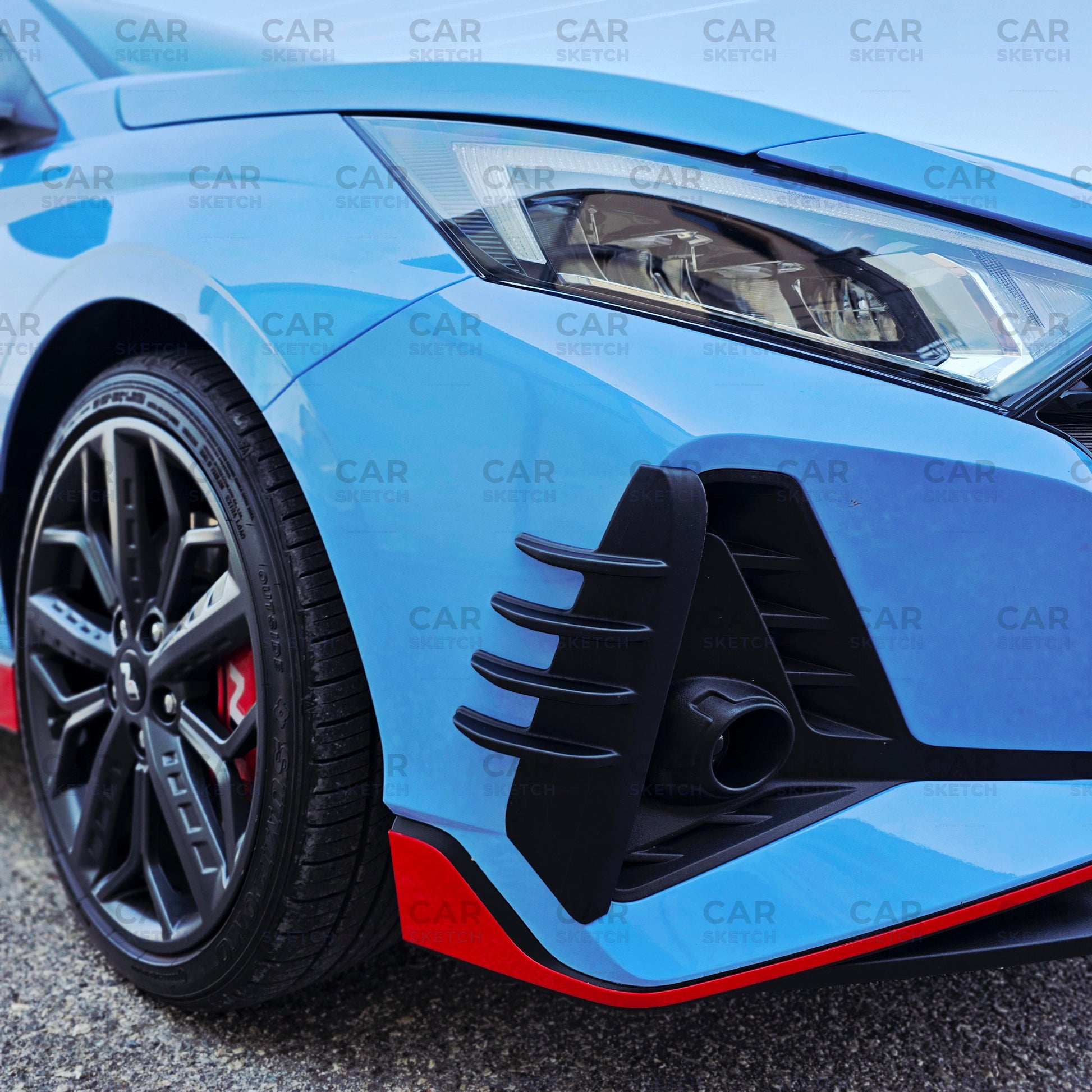 Close-up of black unpainted winglet on Hyundai i20 N bumpe