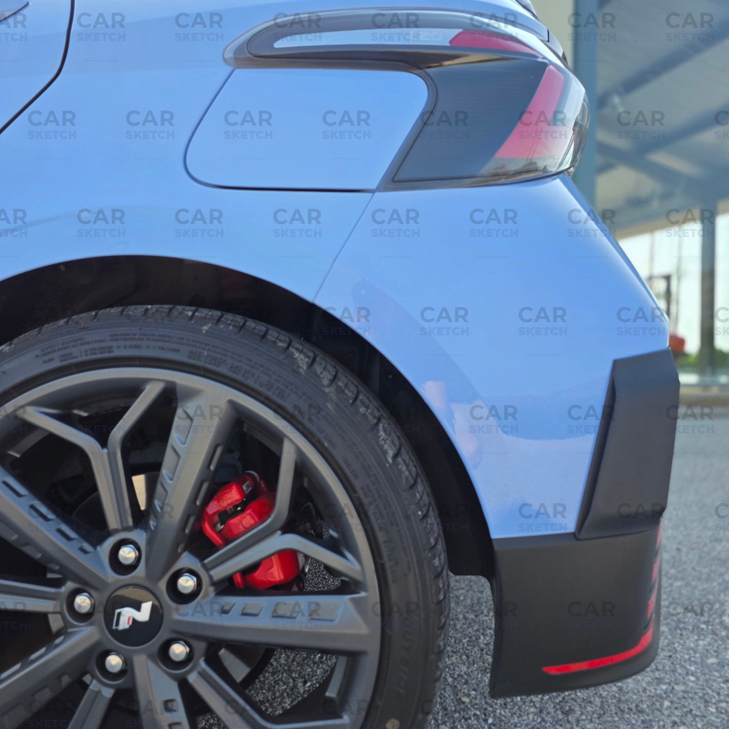 Detailed view of aerodynamic rear bumper fins on Hyundai i20 N